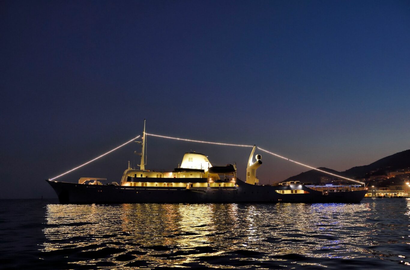 Christina O superyacht charter night time