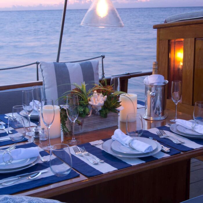 EROS luxury superyacht charter cockpit dining in evening