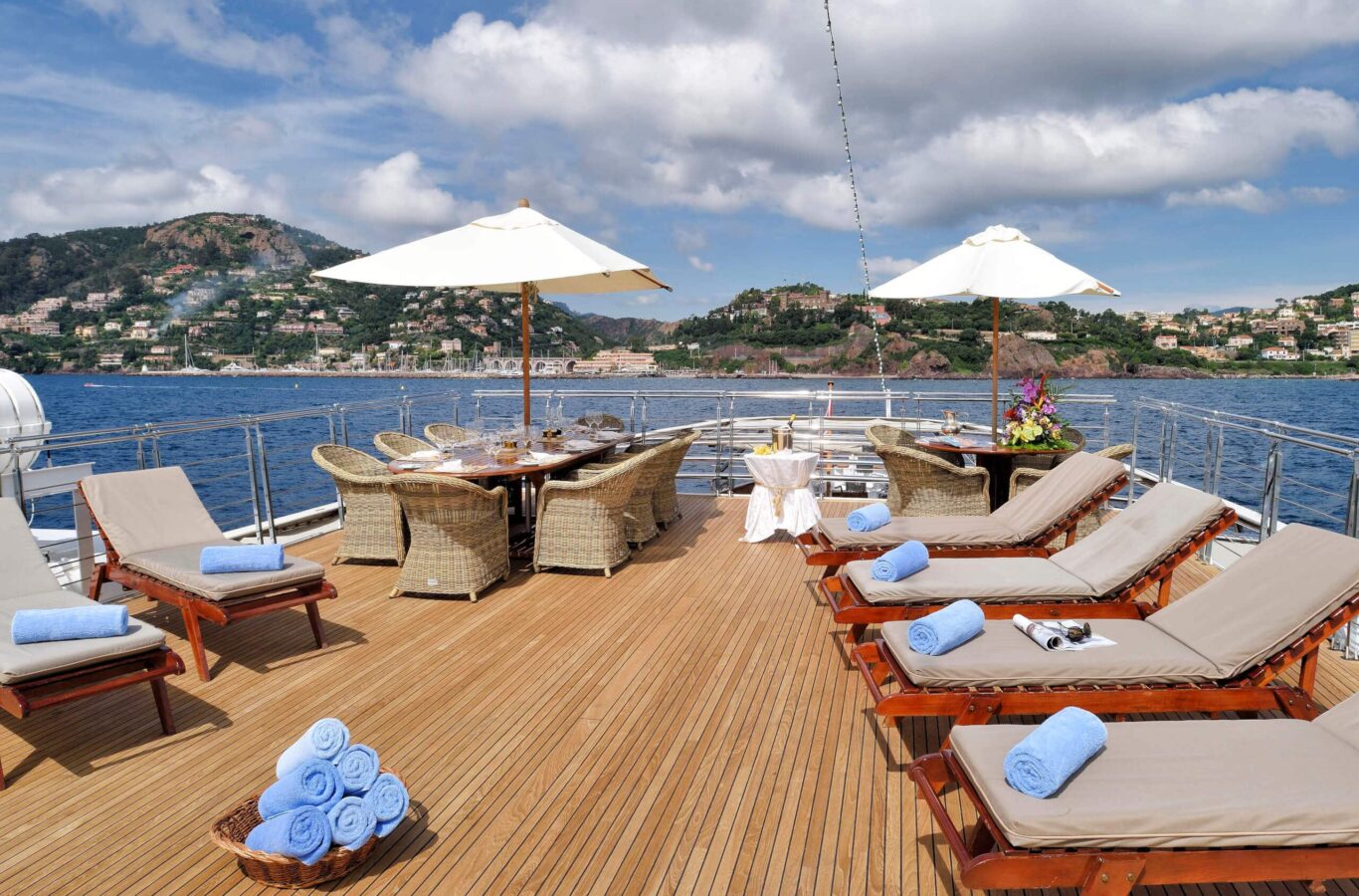 Christina O superyacht charter sunbeds