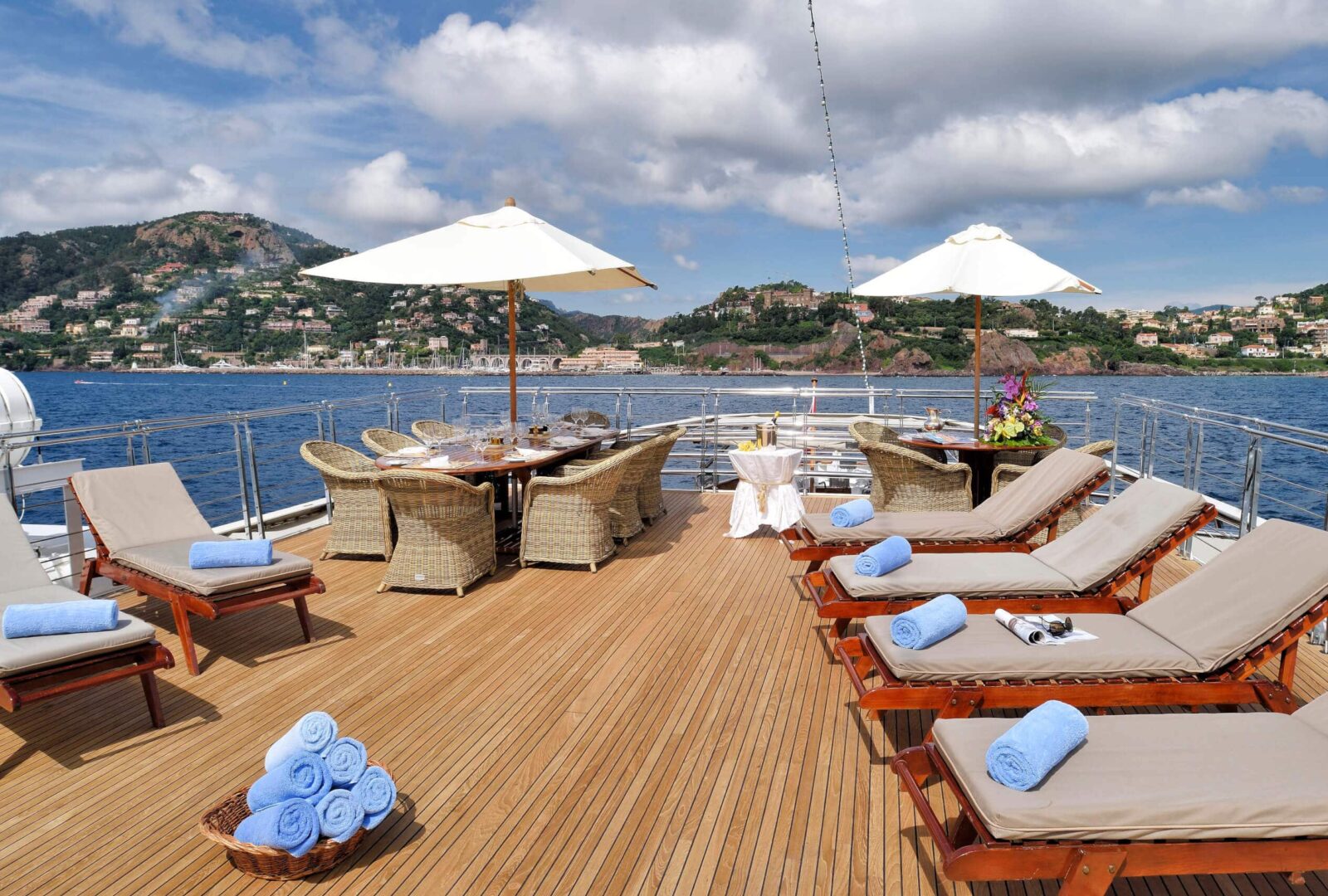 Christina O superyacht charter sunbeds