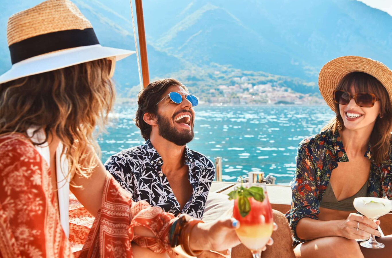group of people laughing and enjoying a superyacht charter