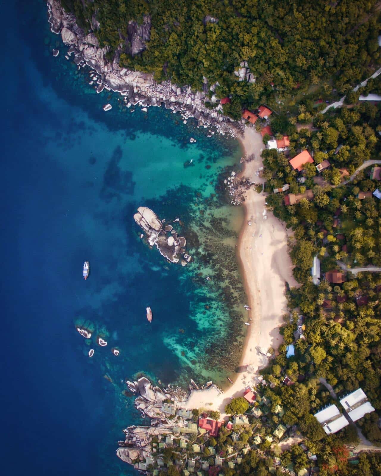 an arial shot of a tropical beach in south east asia