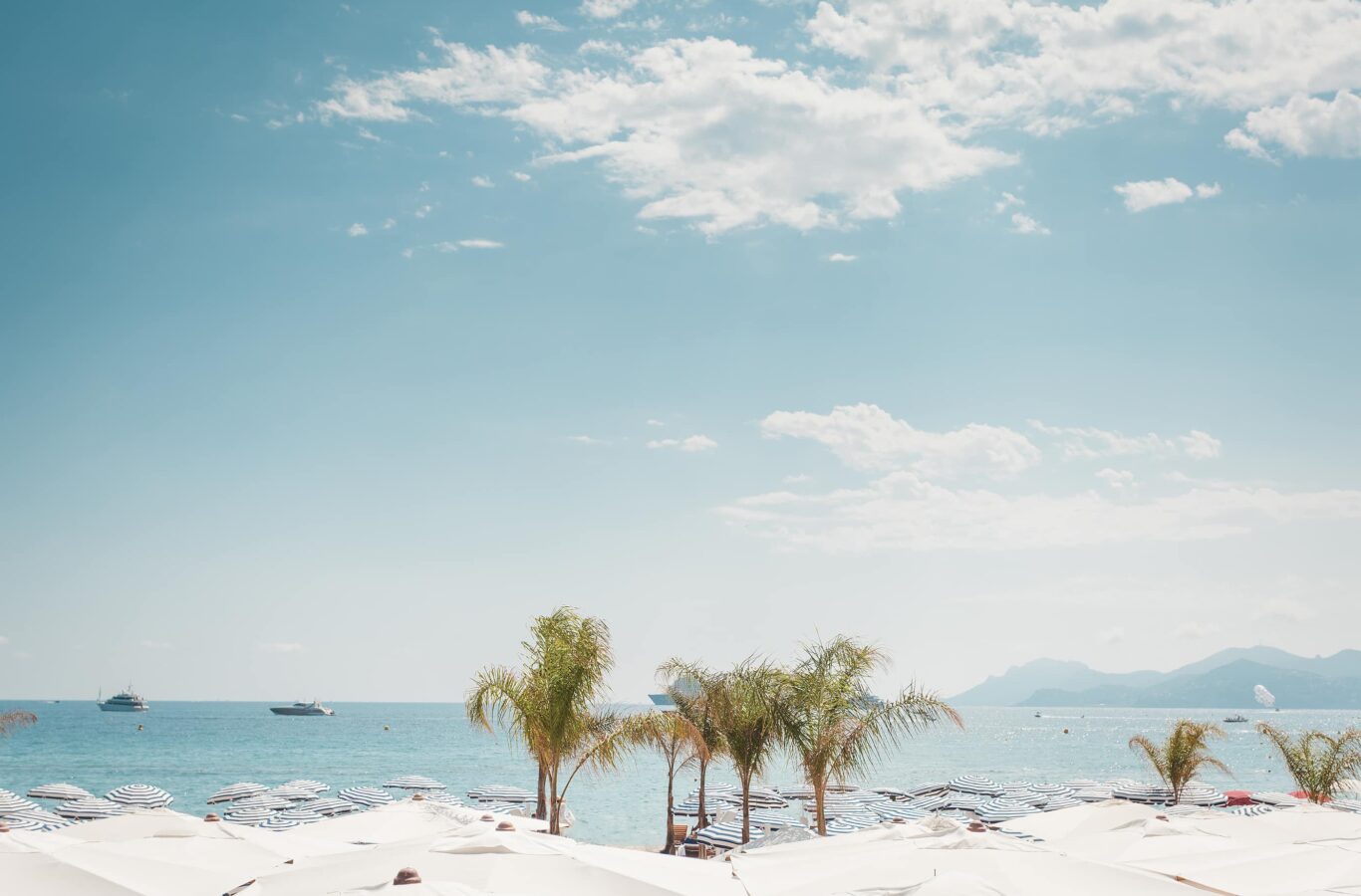 Brigh day on a beach in Cannes, french riviera superyacht charter