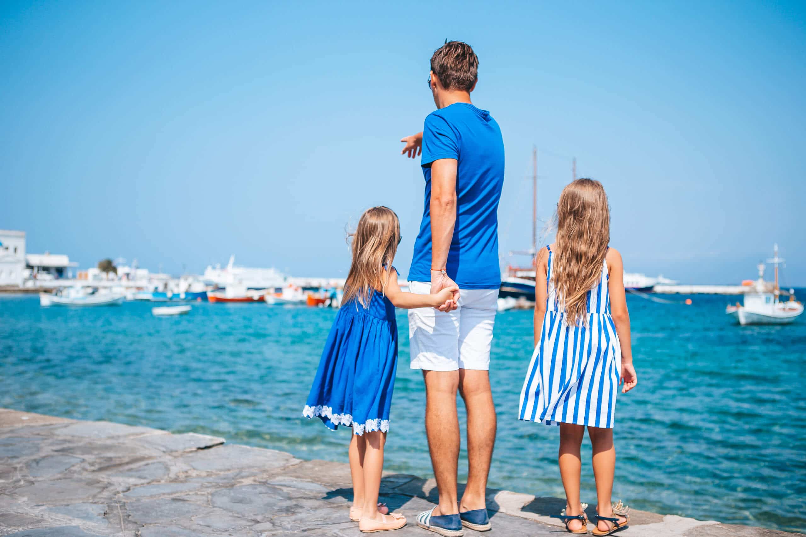 Family having fun outdoors on Mykonos island on a superyacht charter