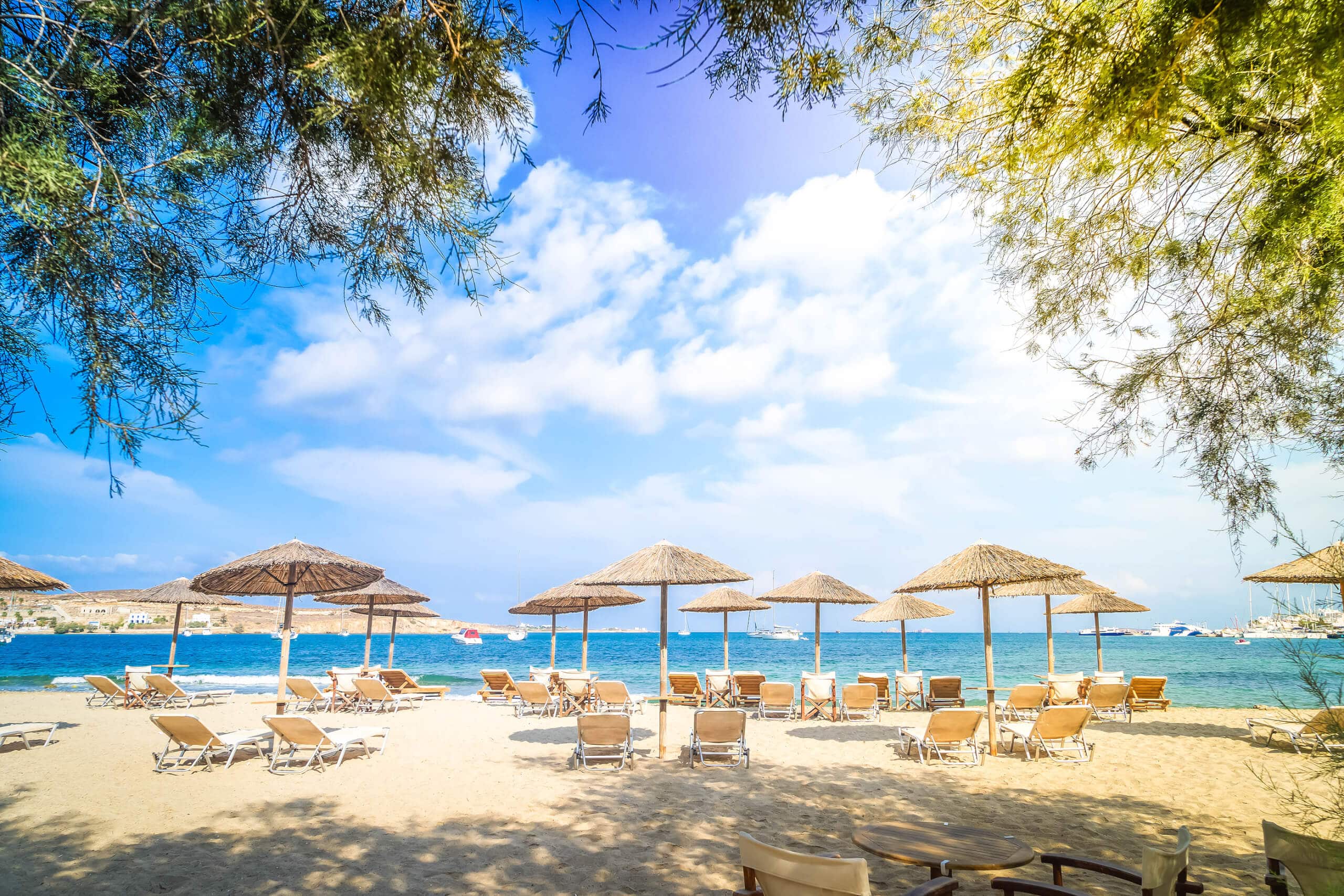 Romantic beach at greek island, Paros Greece with sunshine on a greek superyacht charter