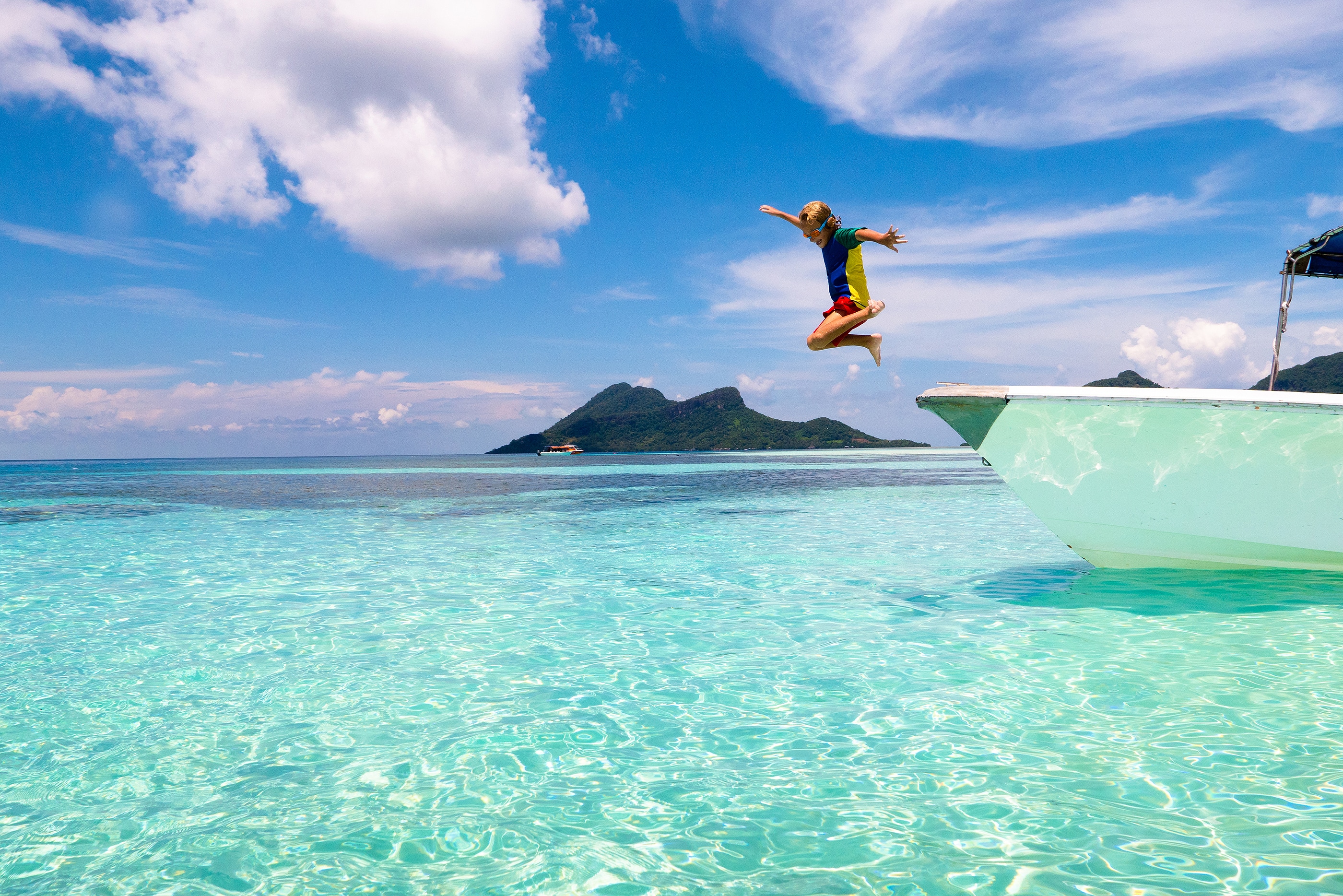 Child Jumping Into Sea Water