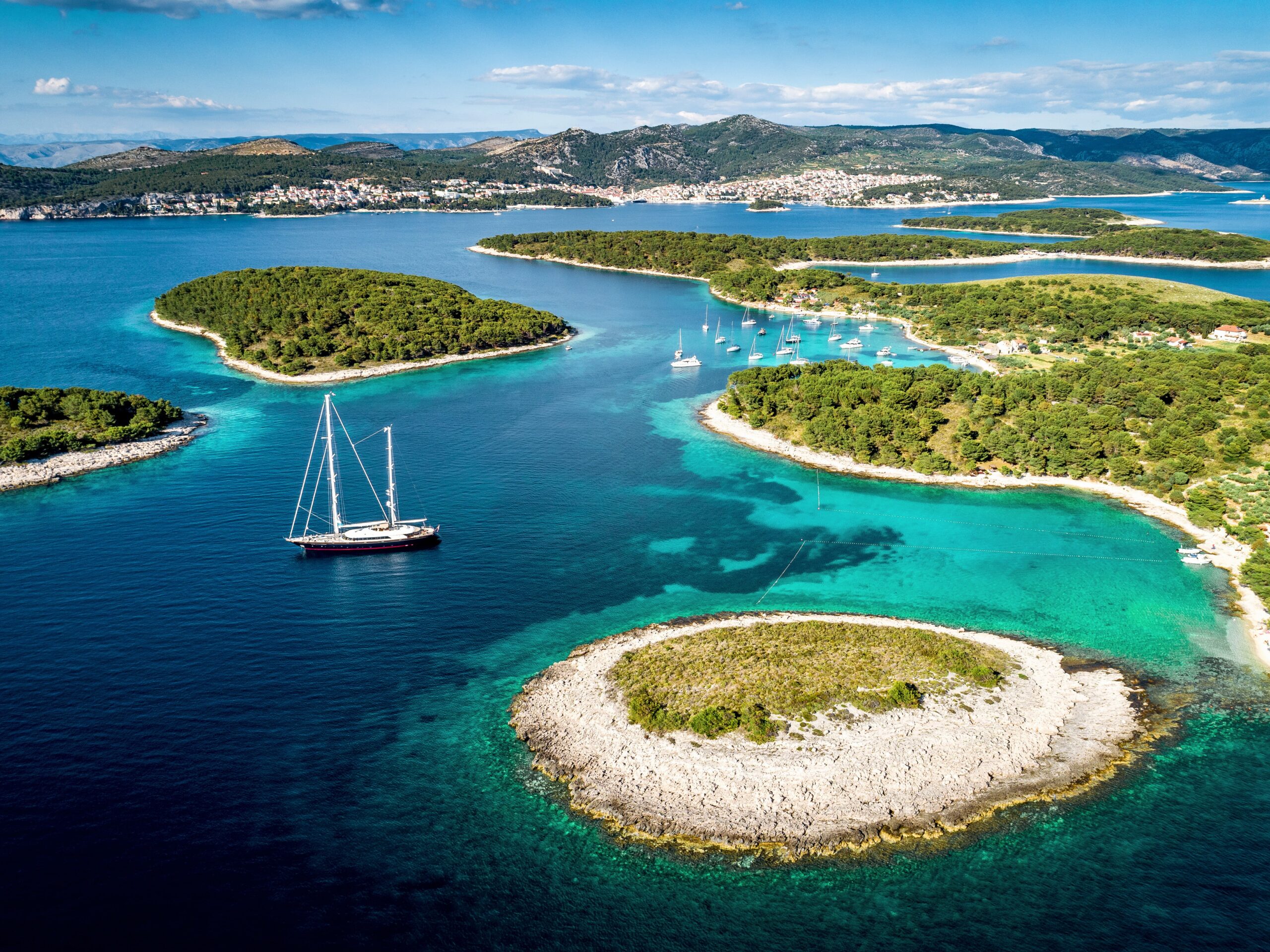 Aerial view of Paklinski Islands in Hvar, Croatia. Turquise water bays with luxury yachts and sailing boats. Toned image.